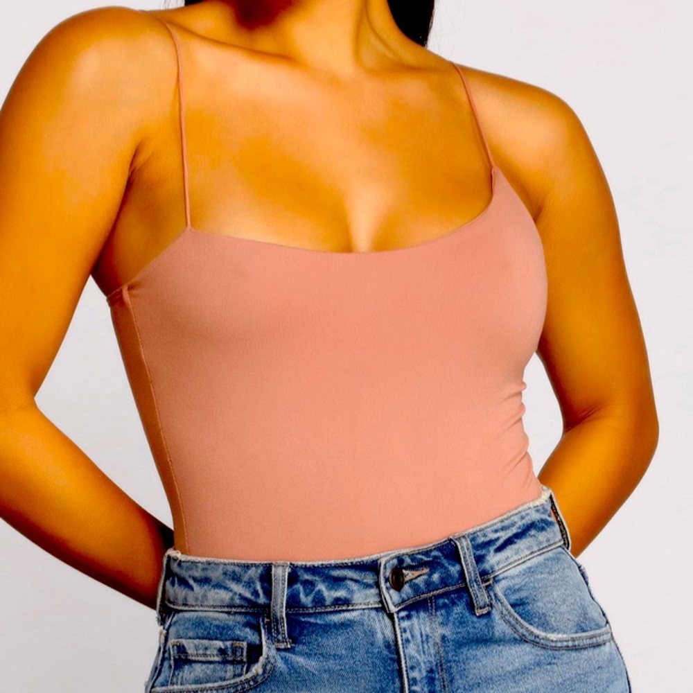 Brand new Asymmetrical spaghetti strap body suit size L